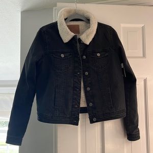 Black jean jacket with faux white lamb fur and silver buttons